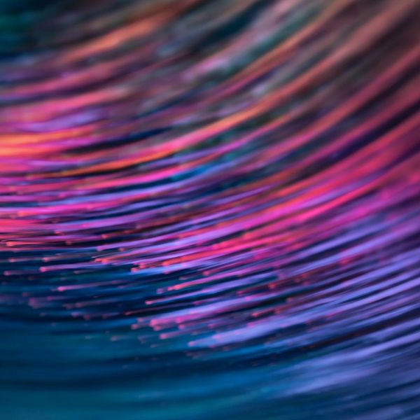 Abstract image of light streaks symbolizing the flow of breath.